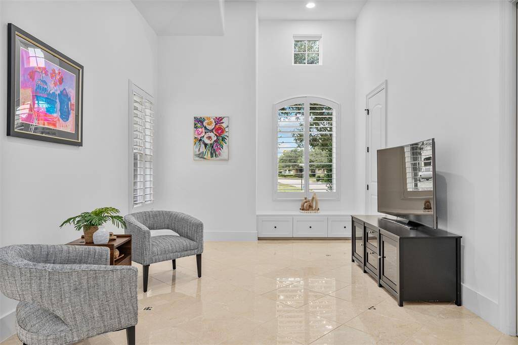 Another space extends from the common area, offering additional versatility that can be tailored for use as a cozy reading area, playroom, or creative studio.