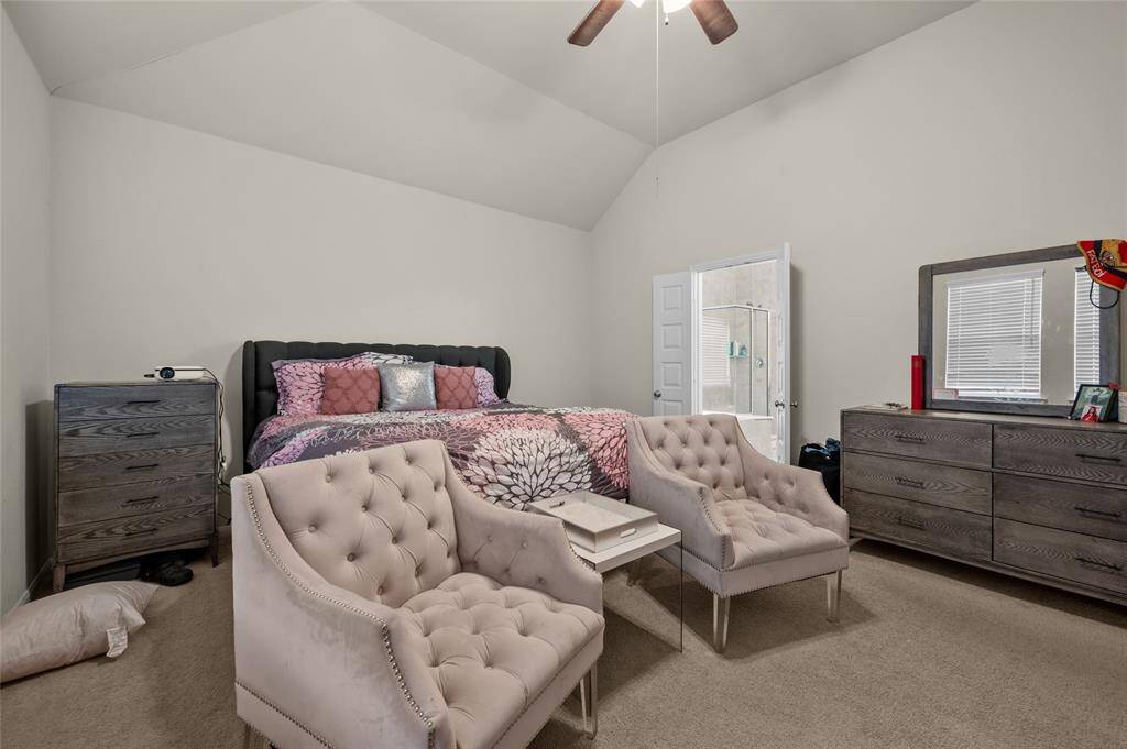 Master bedroom boasting soaring ceilings.