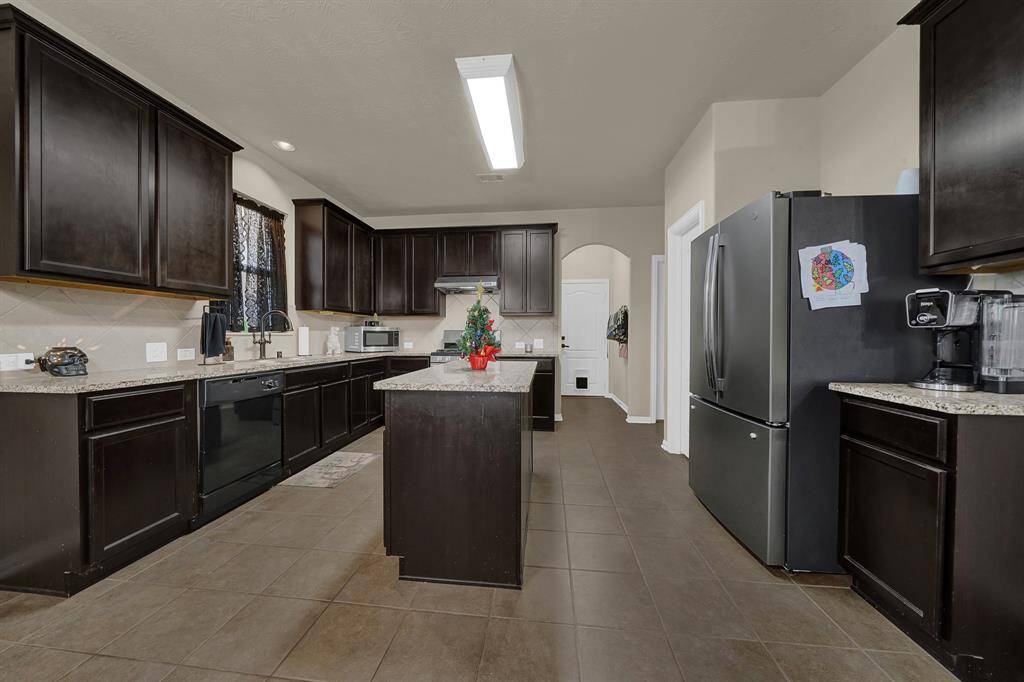 Another view of kitchen with plenty of counter and cabinet space.