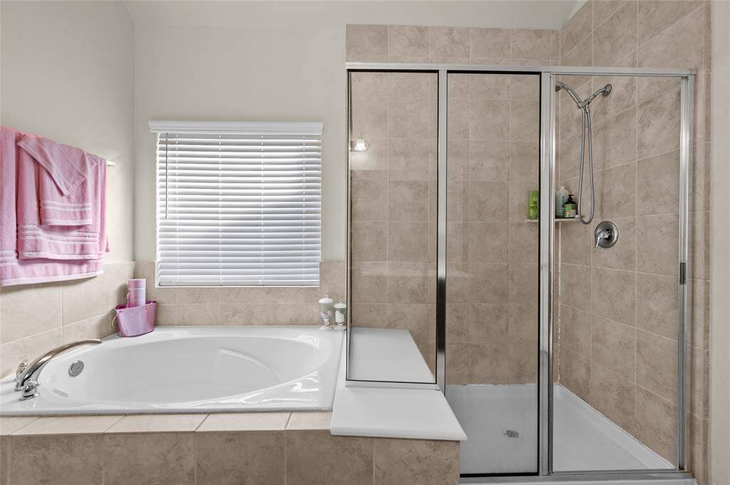 Master bathroom with a separate tub and shower