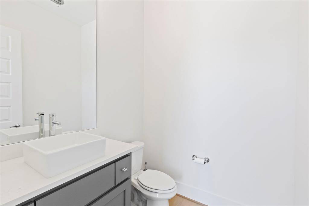 Half bath conveniently located off the back door for easy access from the pool.