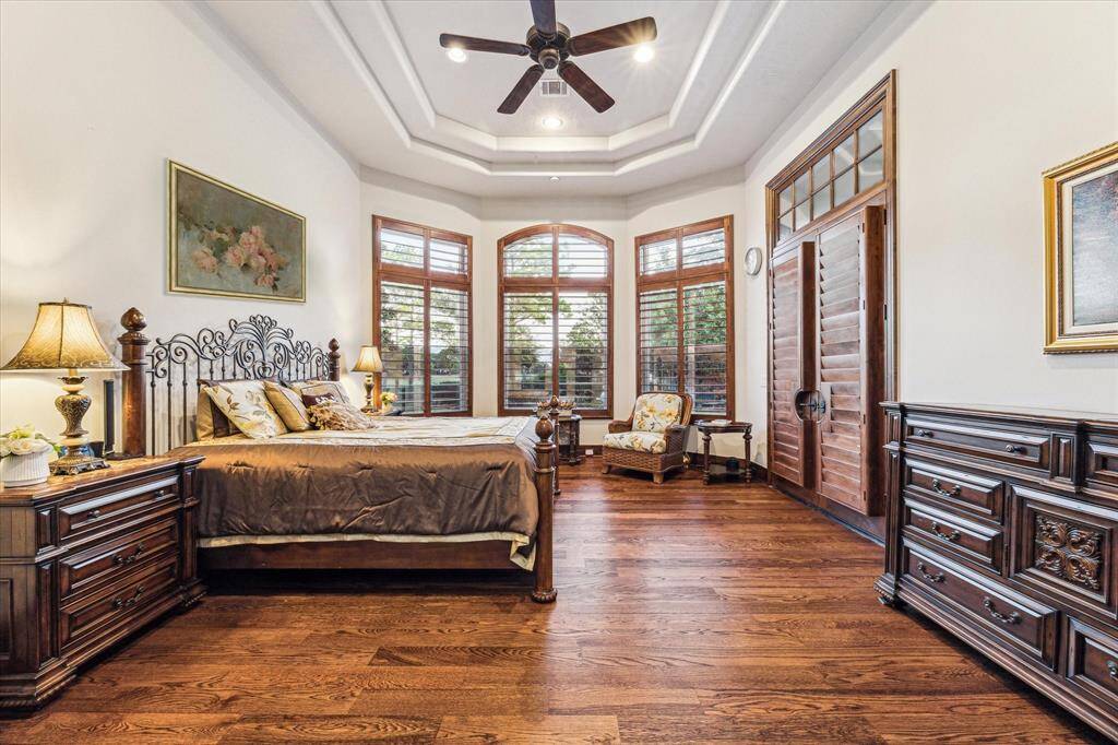The master bedroom exudes elegance with rich wood finishes and offers a stunning view that invites you to start each day in tranquility and style.
