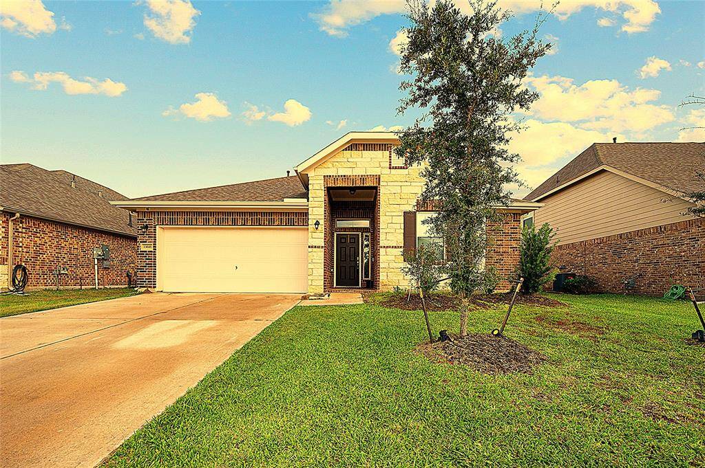 The Front of the home showcasing the 2-car garage and ample driveway space