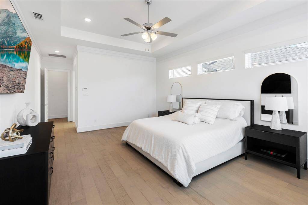 Spacious primary bedroom with beautiful views into the back yard.