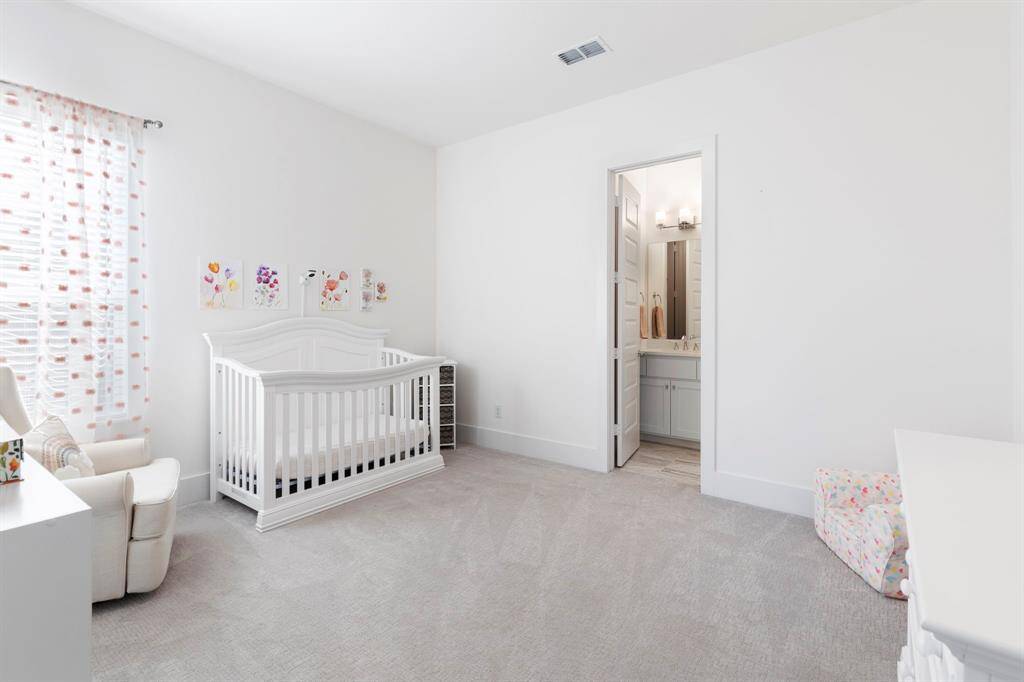 Downstairs secondary bedroom with ensuite bathroom and walk-in closet.