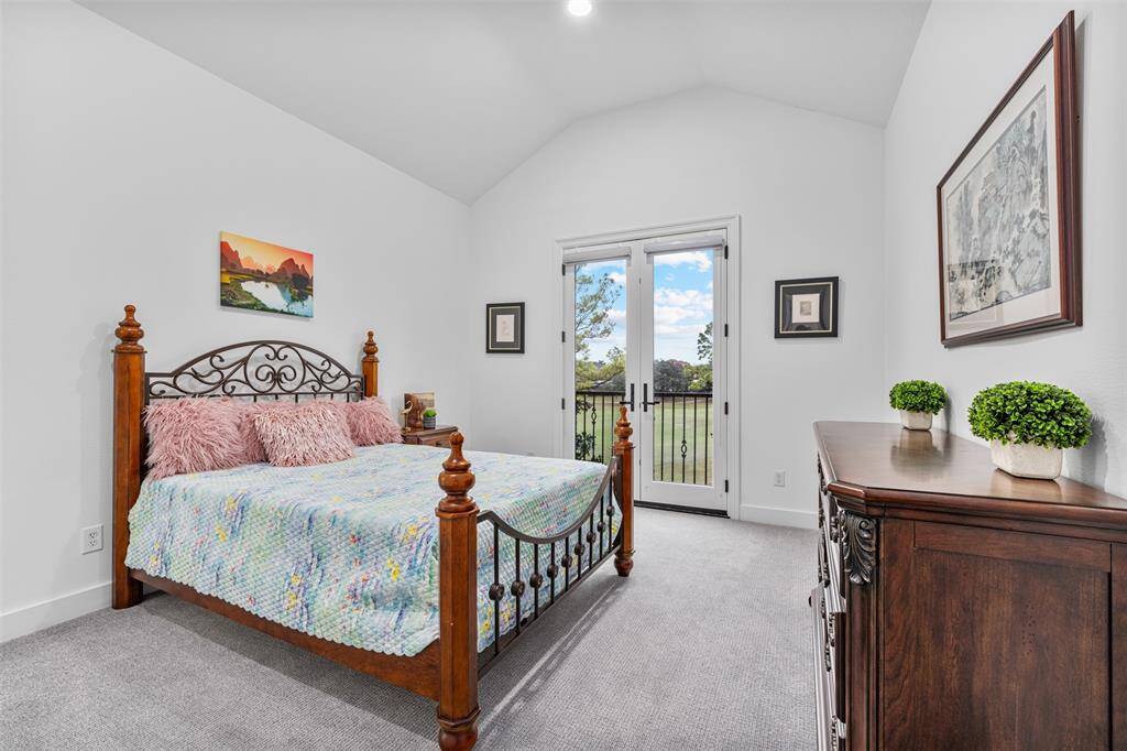 Total of 6 bedrooms: spacious bedroom features elegant finishes and ample natural light, creating a comfortable and inviting retreat for relaxation and rest. This bedroom has a balcony doors for a great view.