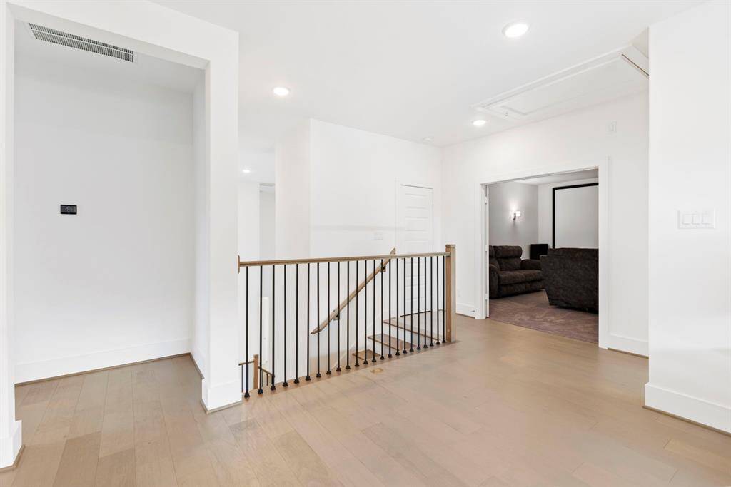 The wood floors are carried through to the second story game room.