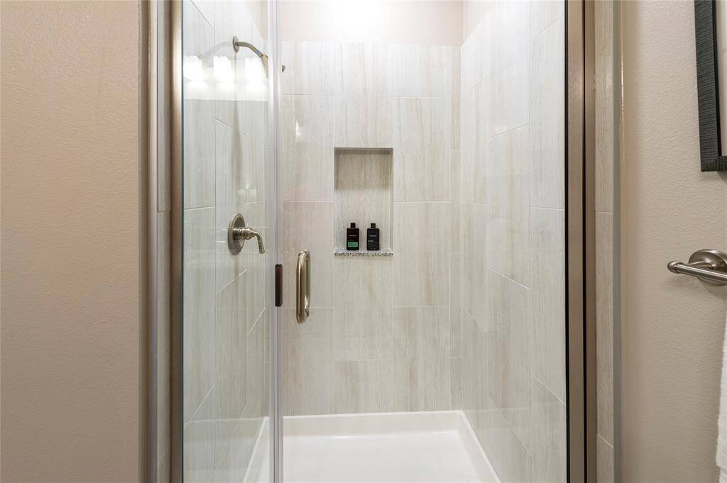 Walk-in shower available on select floor plans -this is the furnished model, not actual unit, photo is for reference only