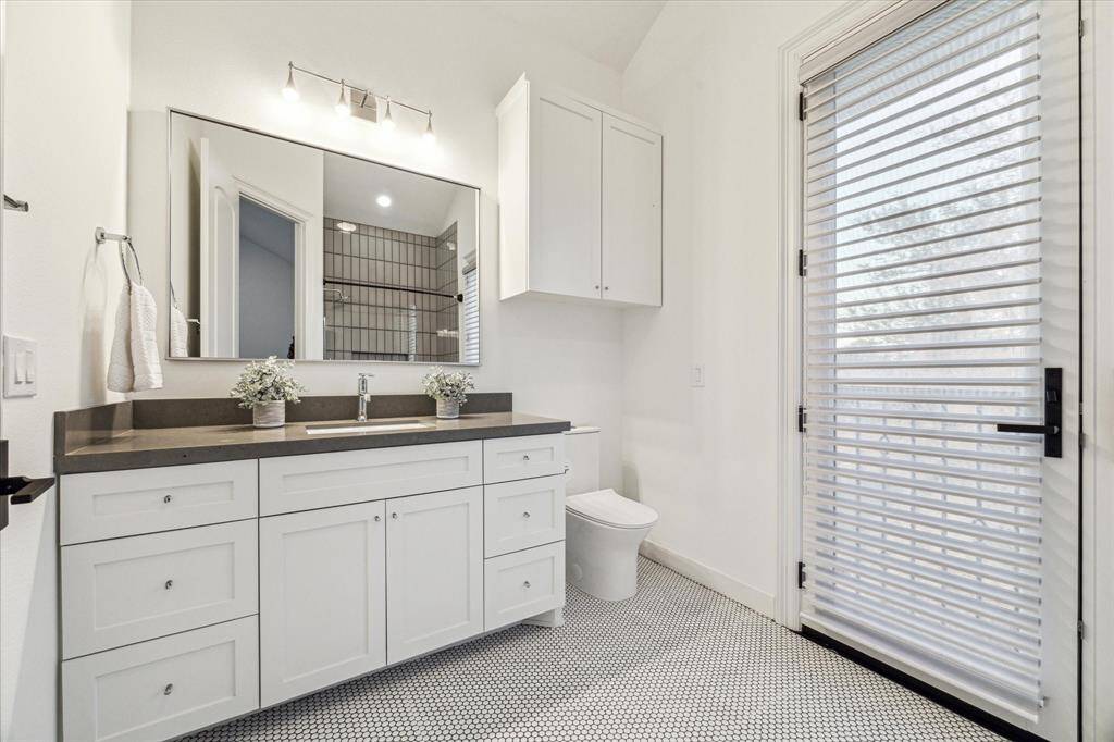 This luxurious home includes six full bathrooms and one half bathroom, each featuring modern finishes and elegant details that elevate the overall experience.