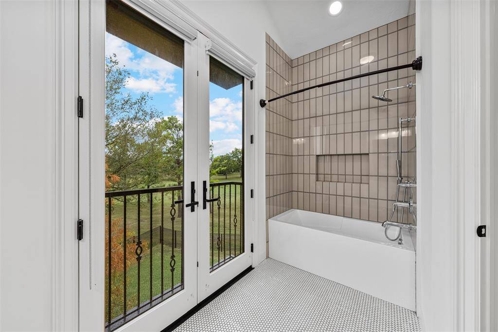 This luxurious home features six full bathrooms and one half bathroom; designed with shower/tub combo on the second floor.