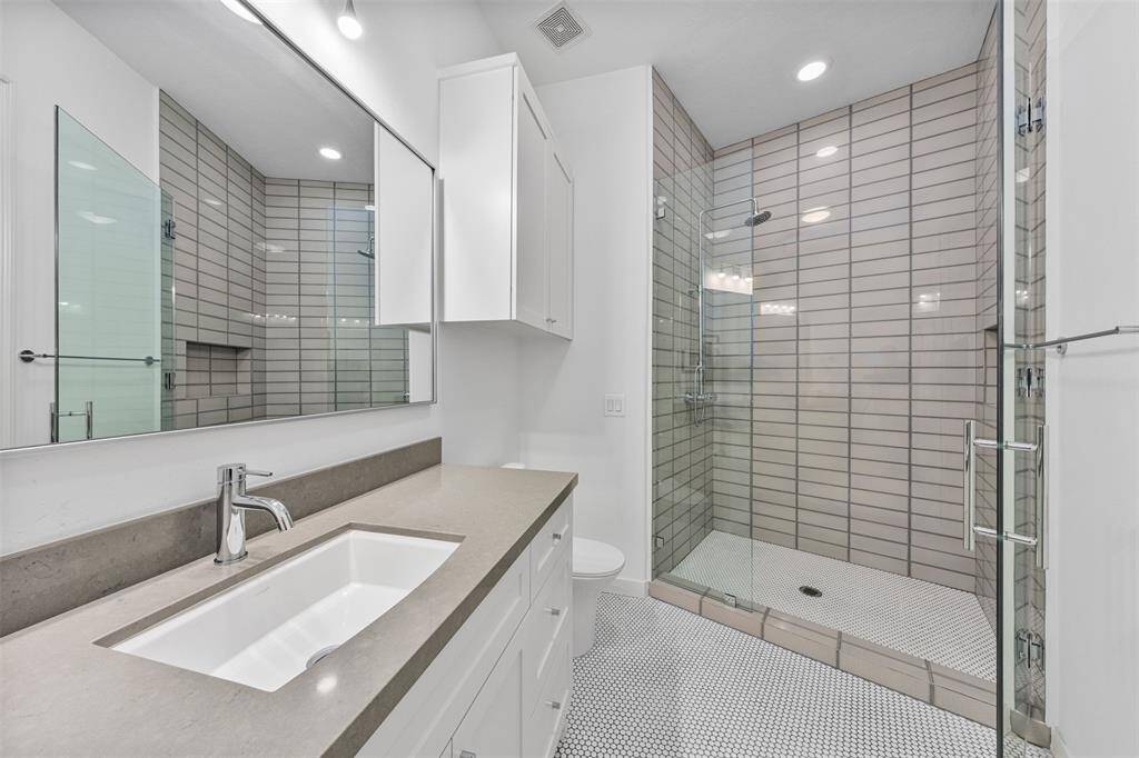 This luxurious home features six full bathrooms and one half bathroom; designed with spacious shower rooms, sinks, and large countertops for added comfort and convenience.