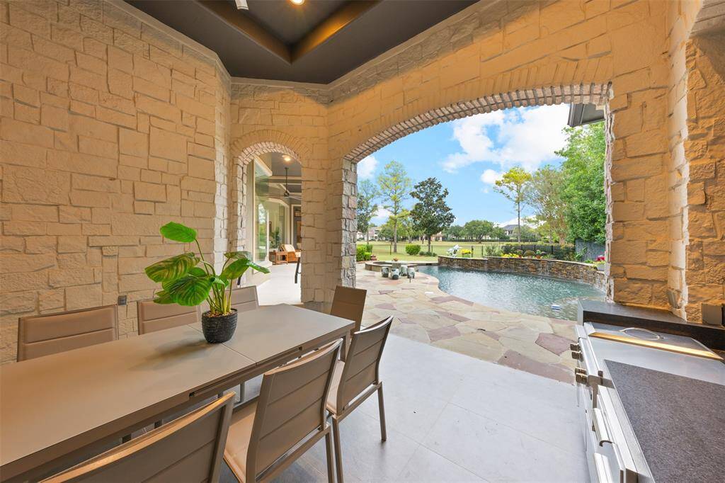 The outdoor kitchen is perfect for al fresco dining, gatherings, and hosting memorable events in a stunning setting. This view showcases an inviting and functional space for entertaining, cooking, and event gatherings.
