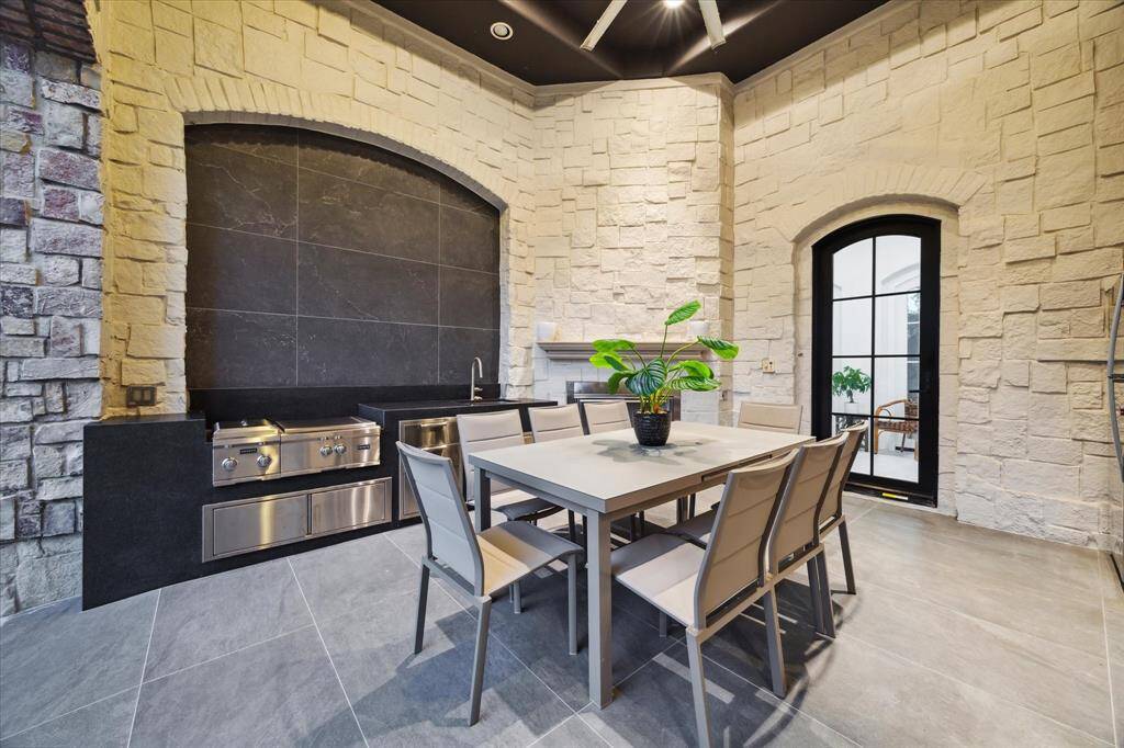 The outdoor kitchen is perfect for al fresco dining, gatherings, and hosting memorable events in a stunning setting.