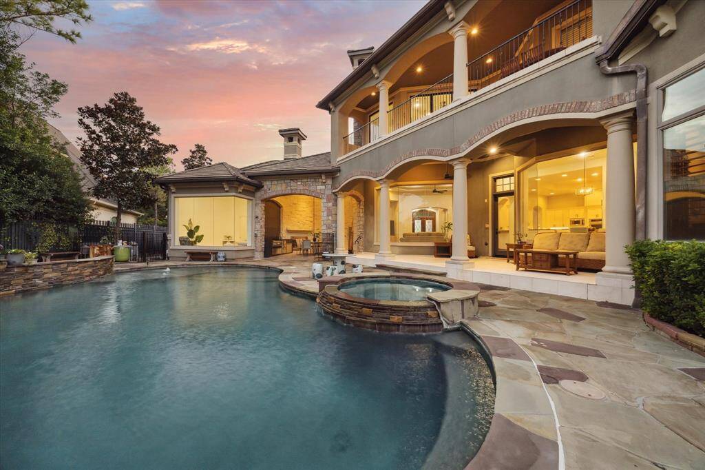 The jacuzzi offers a stunning view of the private pool, creating a perfect oasis for relaxation and unwinding in a tranquil setting.