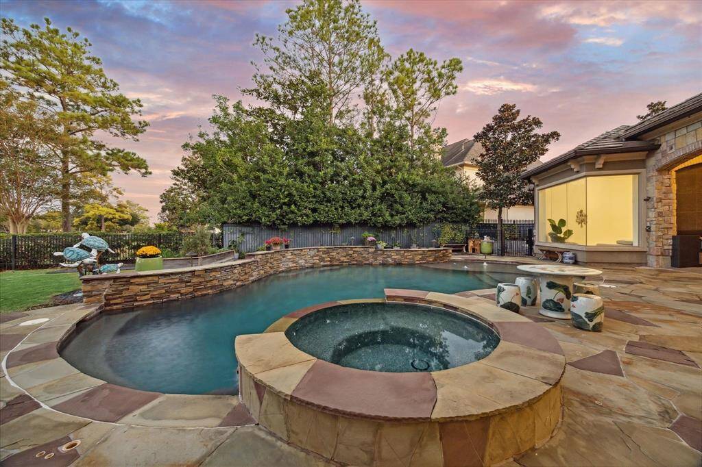 The jacuzzi offers a stunning view of the private pool, creating a perfect oasis for relaxation and unwinding in a tranquil setting.