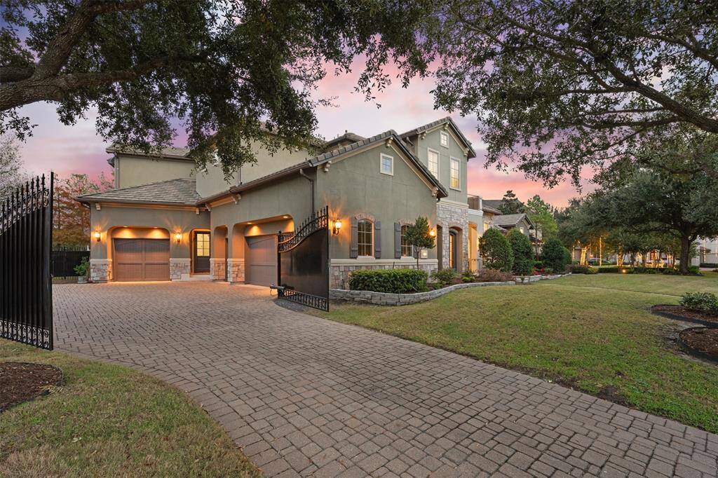 This luxury home offers a convenient side entrance and a spacious three-car garage, providing easy access while maintaining a warm and welcoming ambiance.