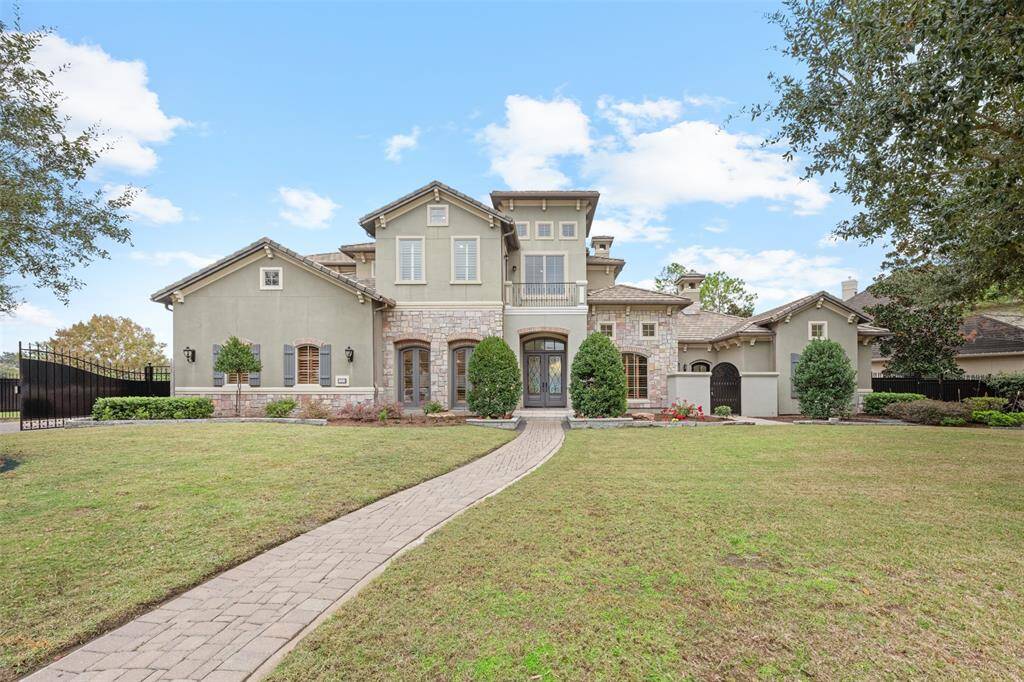 This stunning two-story luxury home boasts a large front yard, perfect for gardening and creating your dream outdoor space. The inviting front door sets the tone for a cozy yet elegant atmosphere, welcoming you into a beautifully designed interior.