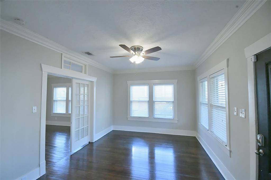 The living room adjoining the master bedroom with double doors