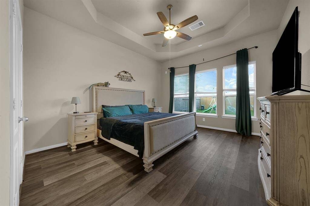 Primary bedroom with natural lighting.