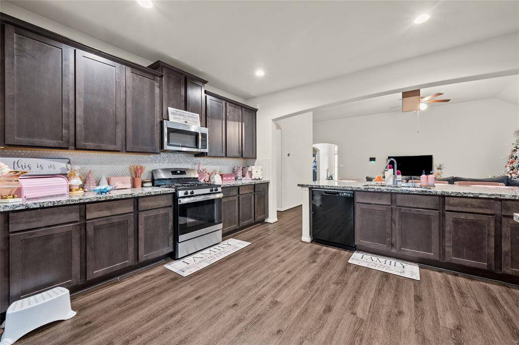 Spacious kitchen with abundant cabinets.