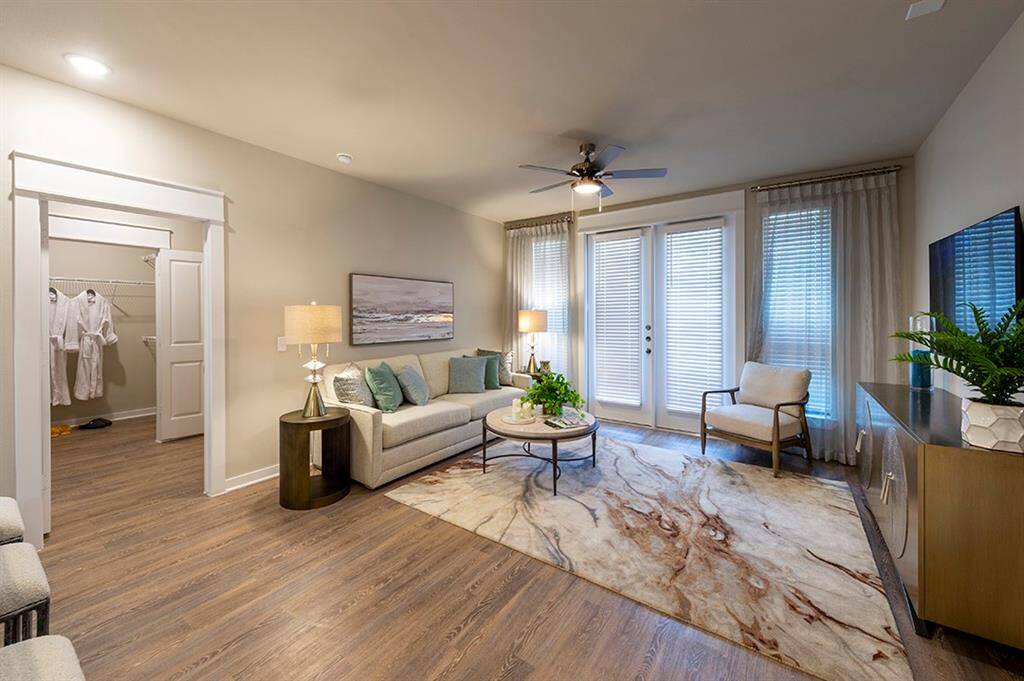 Living and bedroom doorway - this is the furnished model, not actual unit, photo is for reference only