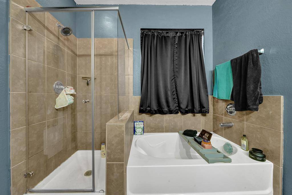 Soaking tub and stand up shower.