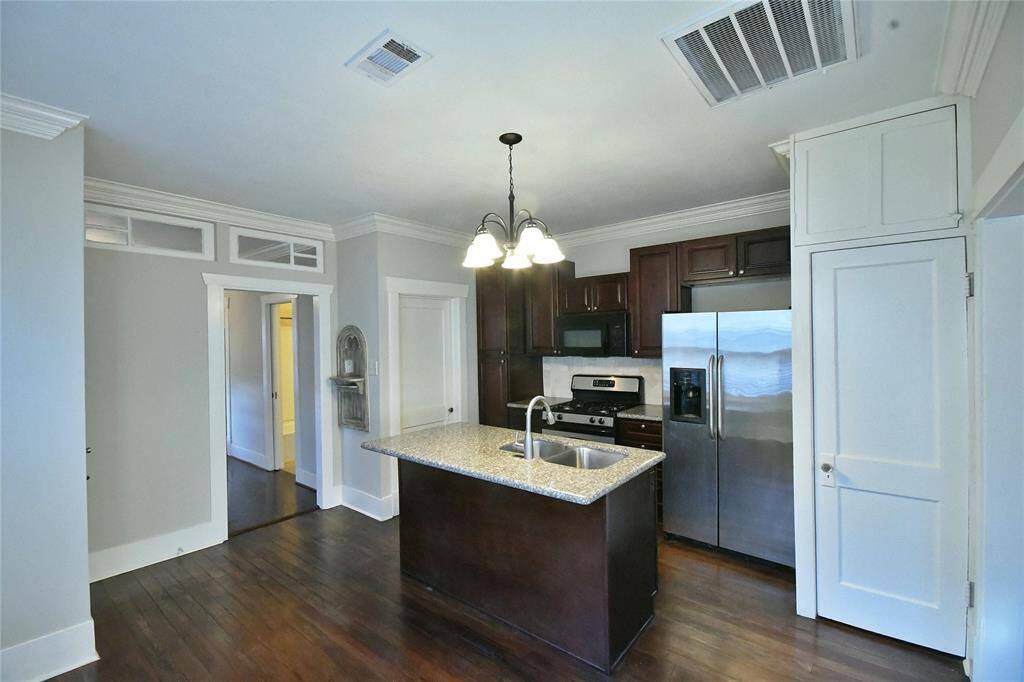 Gas stove with Microwave, Refrig, SS sink in an island.