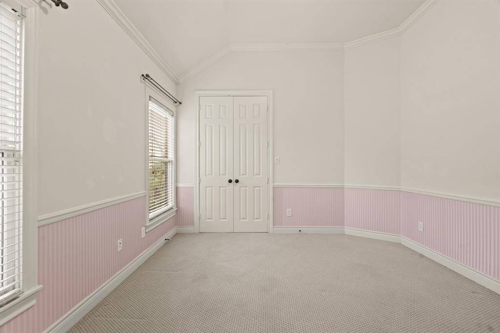 One of the bedrooms with access to back porch