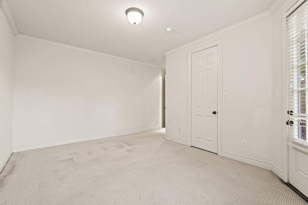 Large primary bedroom with loads of natural light