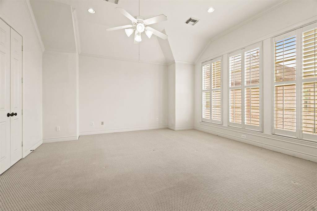 Spacious primary bedroom with space for sitting area or computer niche
