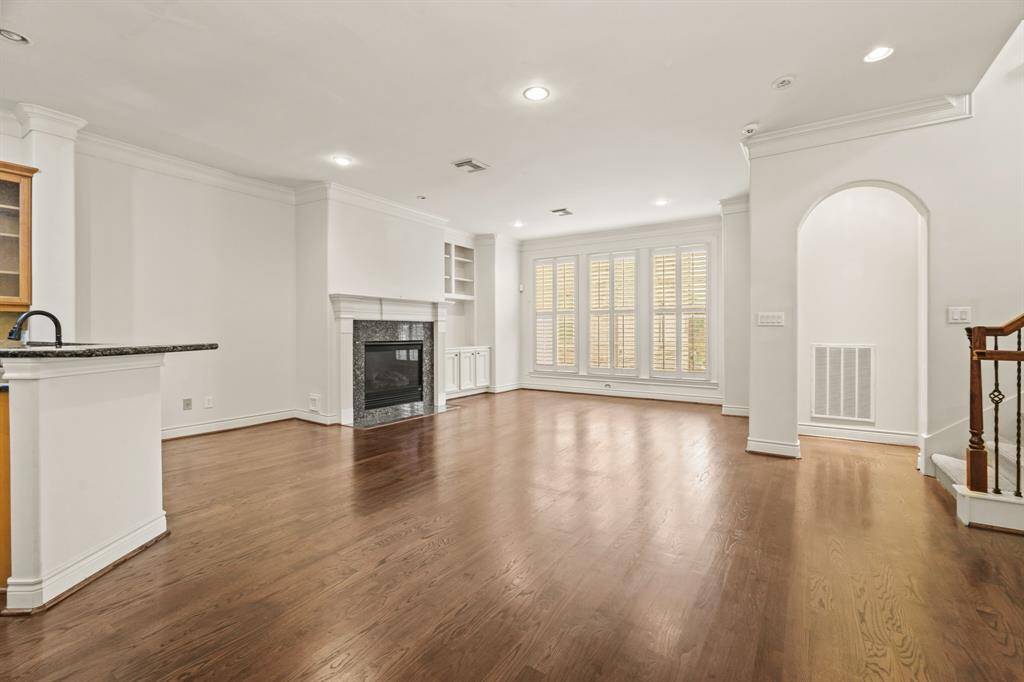 Another view of the grand entertaining area with access to half bath