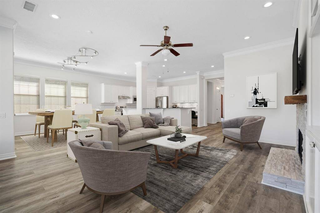 Living room with lots of windows & natural lighting.