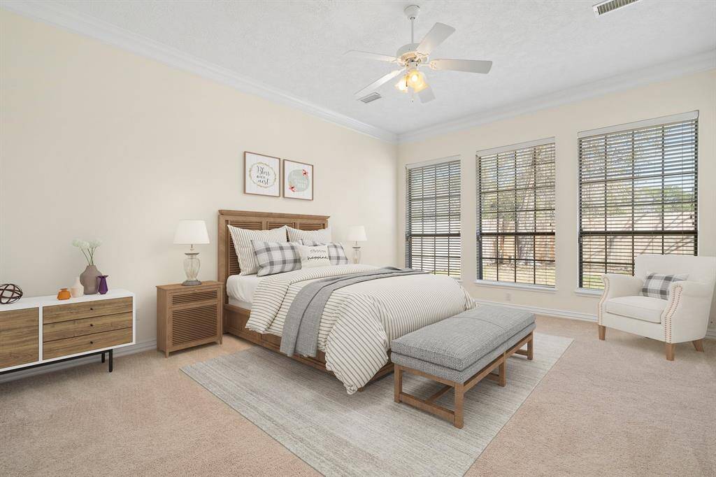 Primary spacious bedroom in the back of the house, with en suite bath