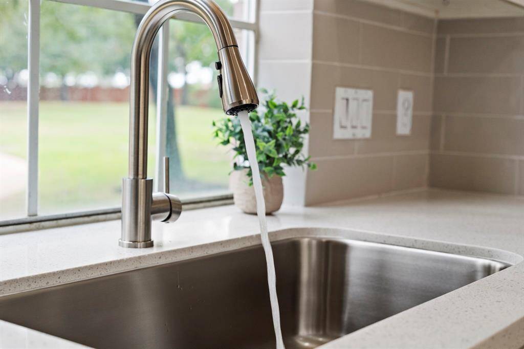 The new sink and faucet are stainless steel.