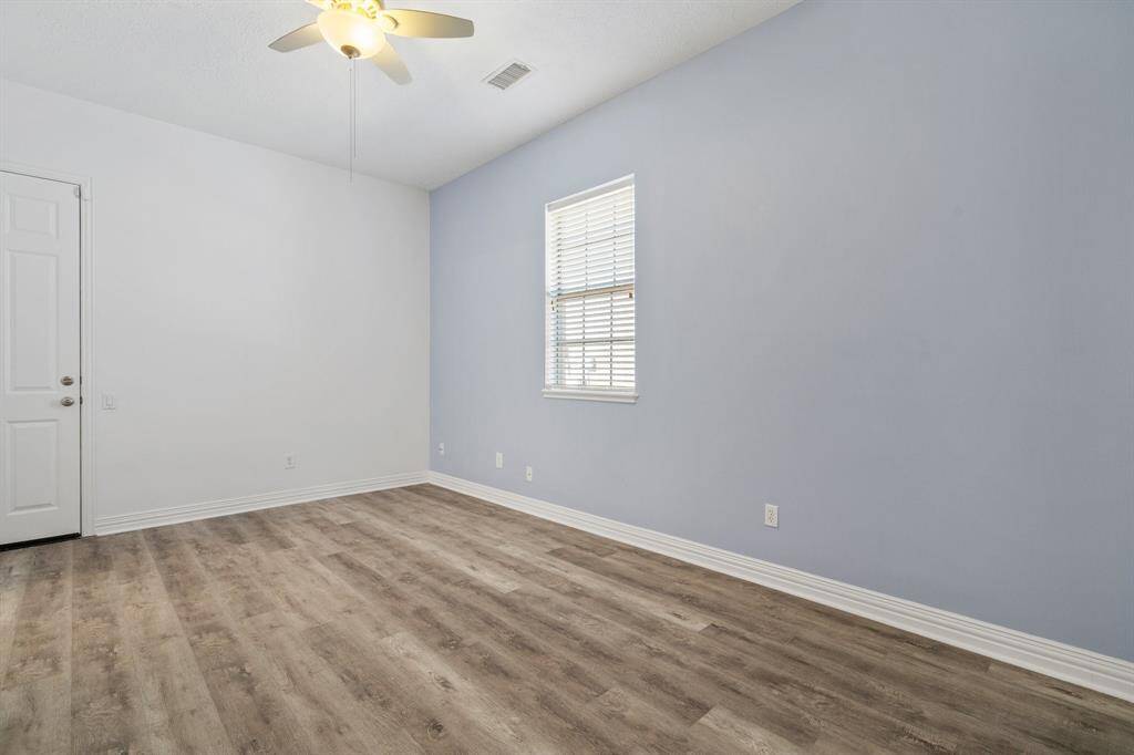 Game room area /room with entrance from the garage. (contains spiral staircase)