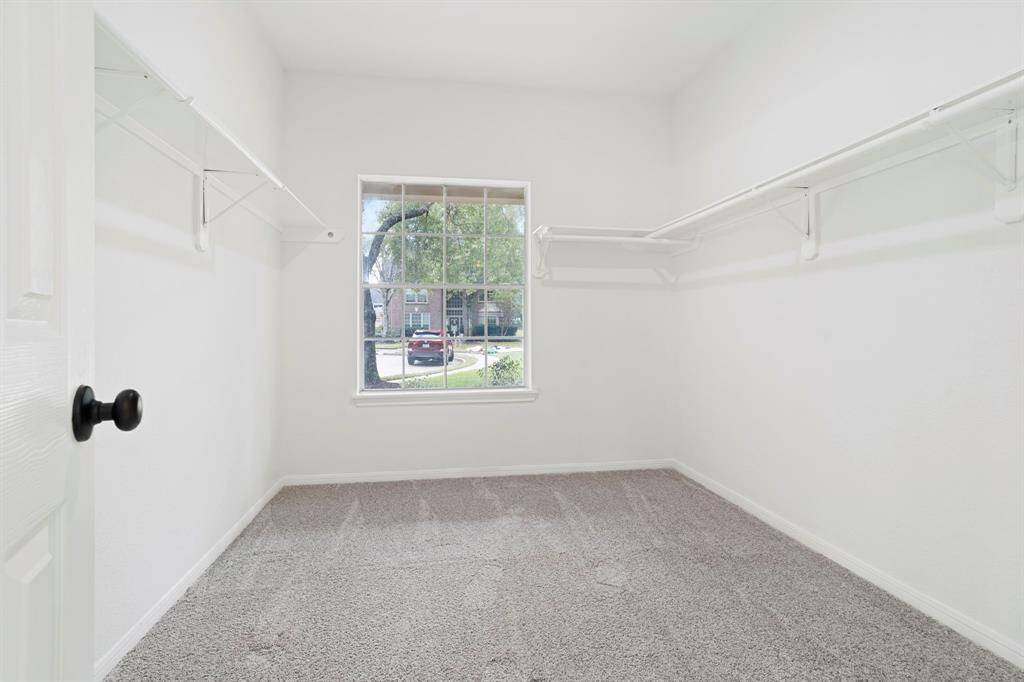 The primary closet also has a large window providing plenty of natural lighting.