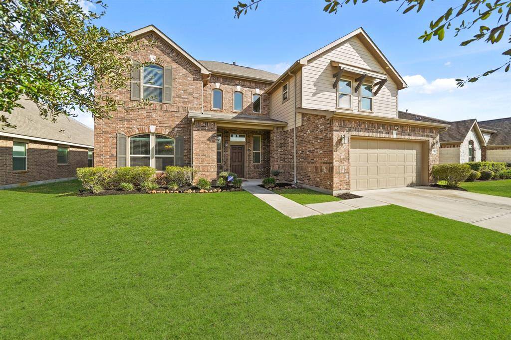Charming brick home with a welcoming porch, two-car garage. A standout with timeless design and great curb appeal!