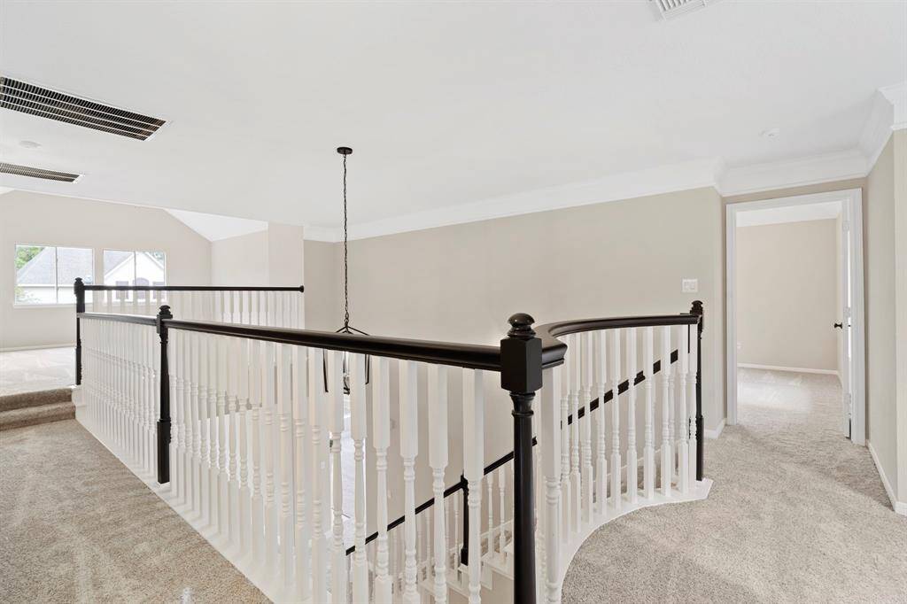 Right upstairs is the balcony overlooking the entryway and living room.