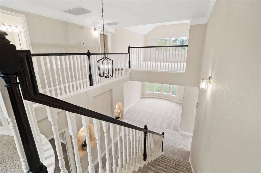 From upstairs you have another view of the spacious living room.