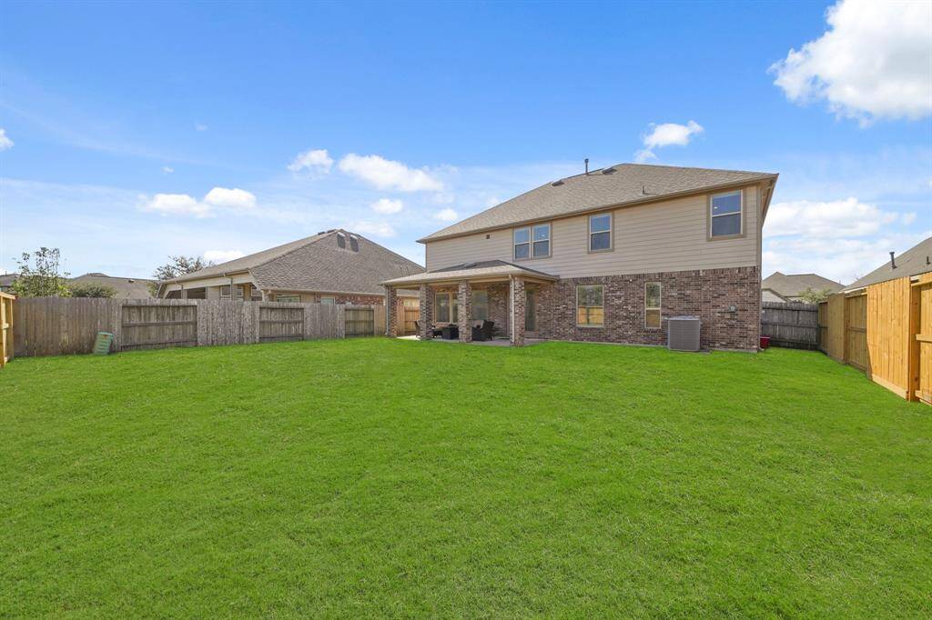 Spacious backyard ideal for outdoor activities and potential landscaping opportunities.