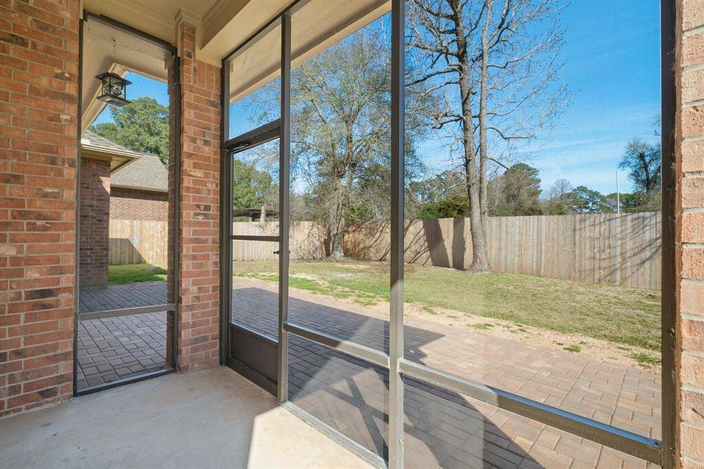 Screened in porch in back, off of the kitchen area. Large tree just removed in the new patio area. All new cedar privacy fence in back. Lots of room for pool if desired.