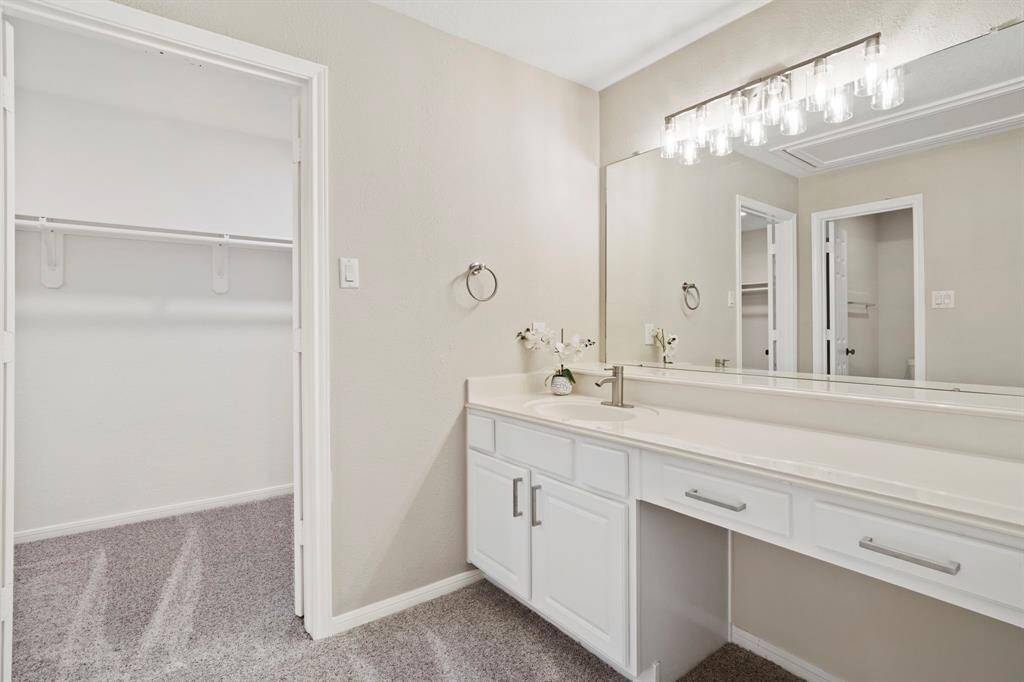 Third bathroom features a longvanity with plenty of counterspace.