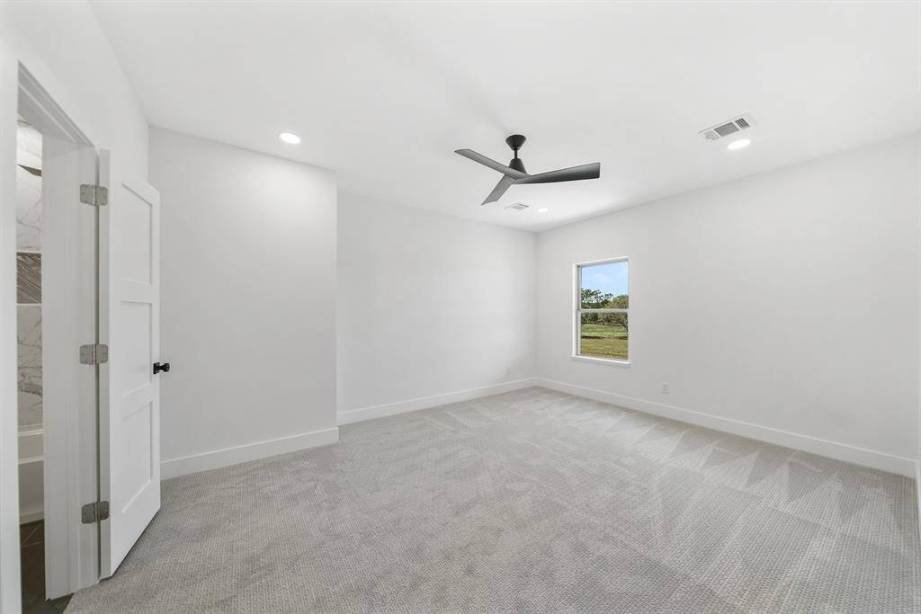 Additional spacious bedroom with attached bathroom upstairs offering stunning views.