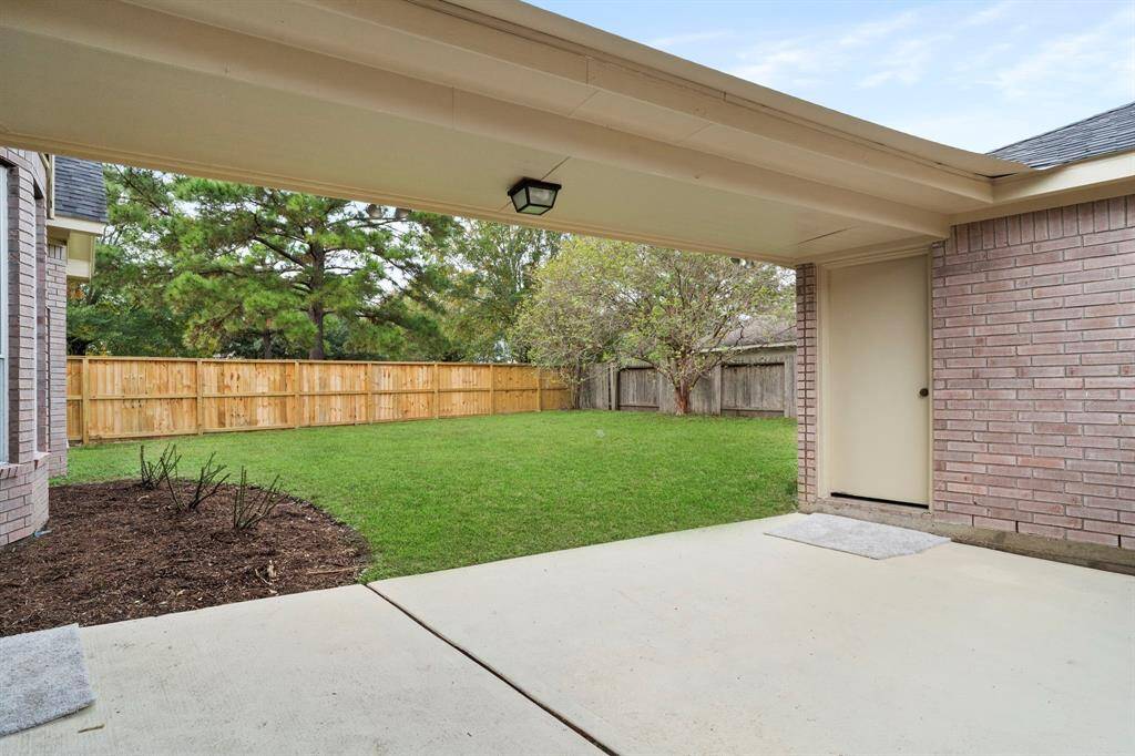 The covered walkway leads to the detached garage.