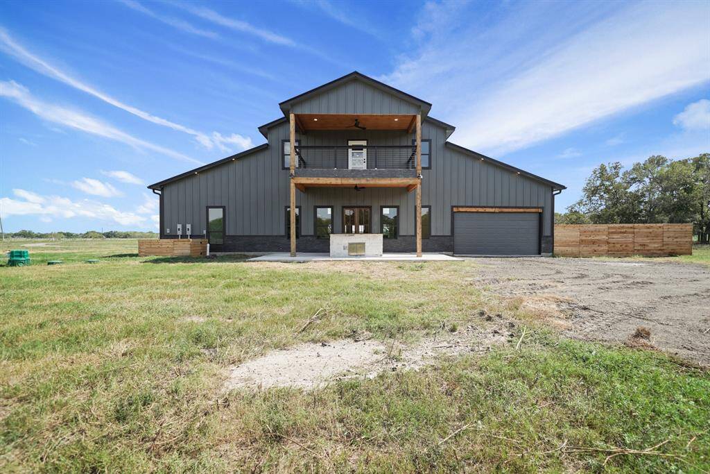 It is set on a wide expanse of open land, providing a serene rural atmosphere.