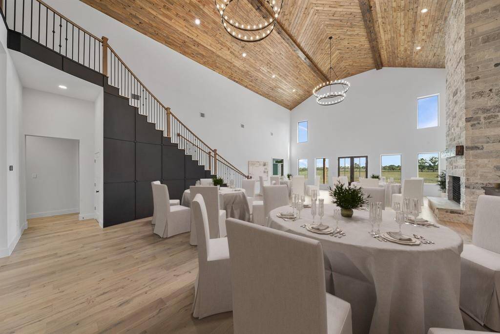 The open-concept design is perfect for entertaining, with stylish dining setups and beautiful outdoor views. Virtual staged setting