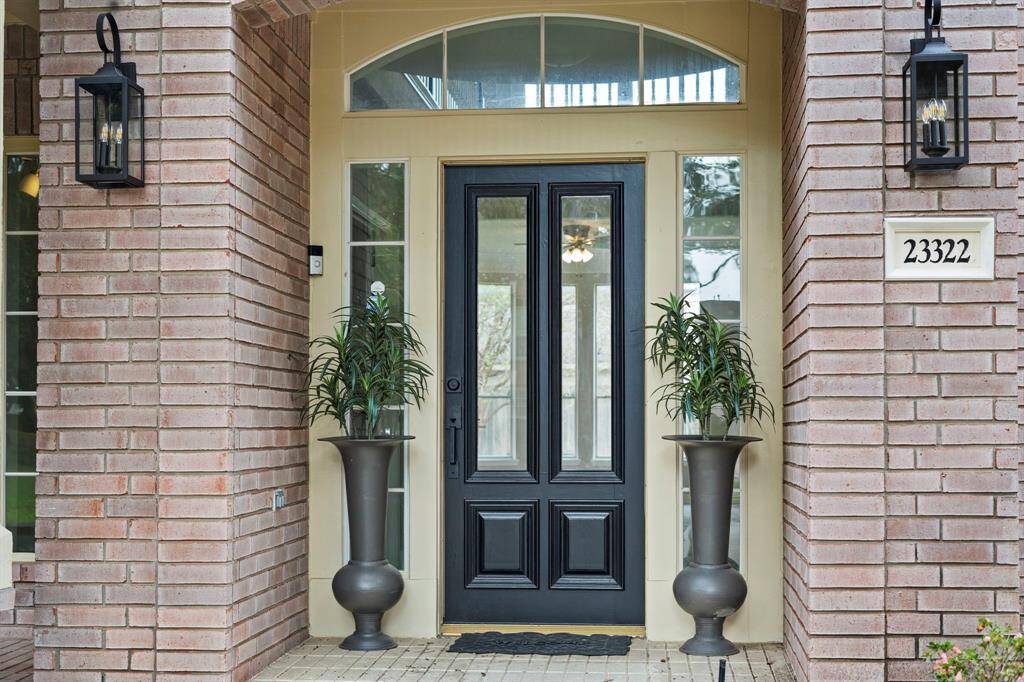 Approaching the front door youwill see the brick elevation,covered front porch, andlandscaping.