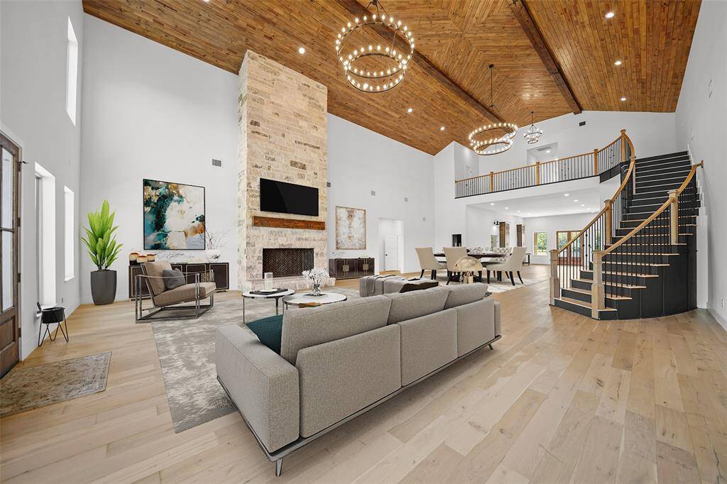 The large windows provide ample natural light. Perfect for luxurious living and entertaining.Virtual staged setting.