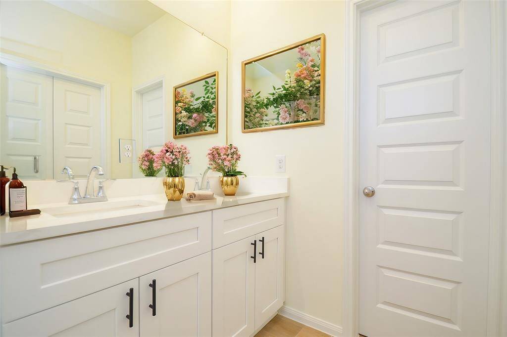 The double vanity provides ample space for personal care and storage.