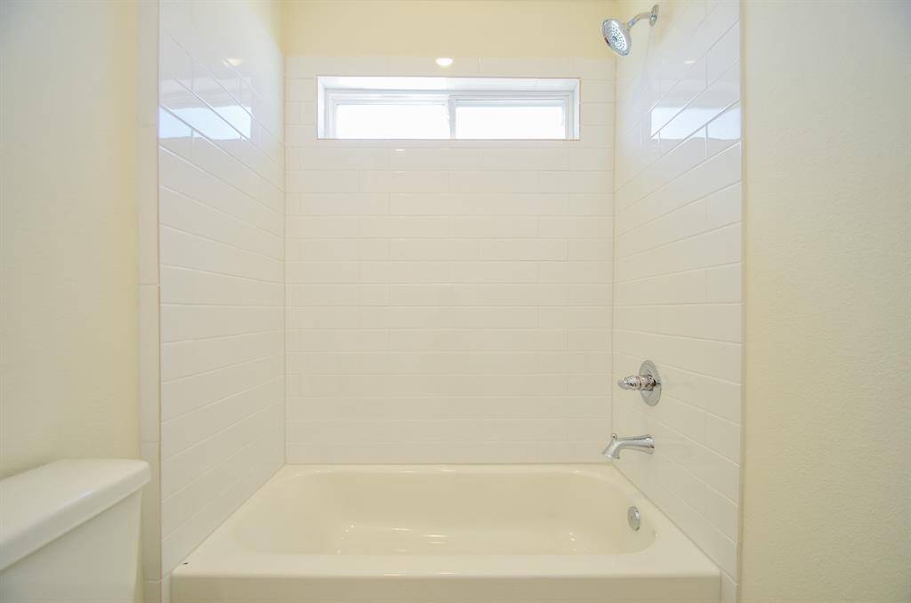 The combination tub and shower offers versatility and convenience.